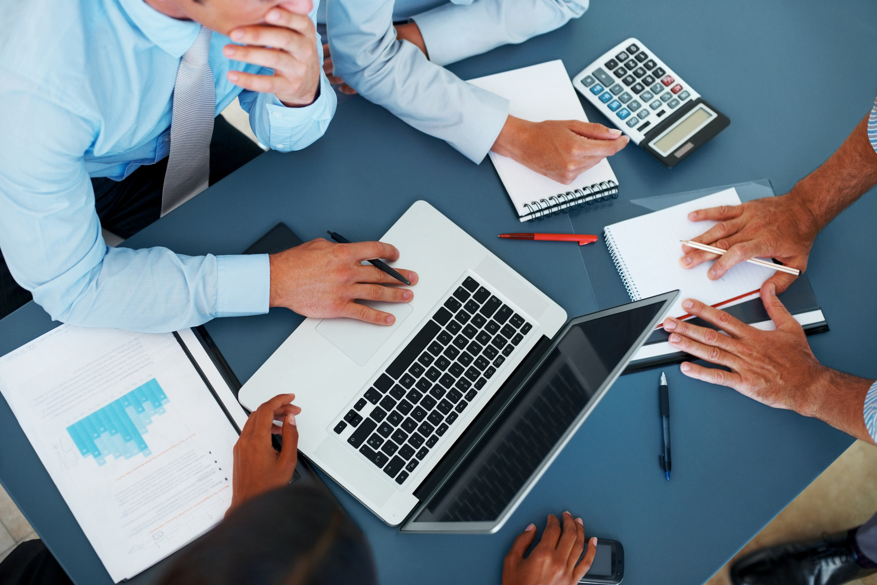 Cropped image of group of businesspeople working together in office - Consulting