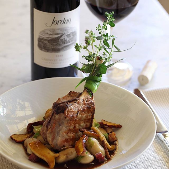 Staying home for Valentine's Day this year? Try our Grilled Pork Loin with Maitake Mushrooms and Cannellini Beans recipe: jordanwinery.com/recipes.